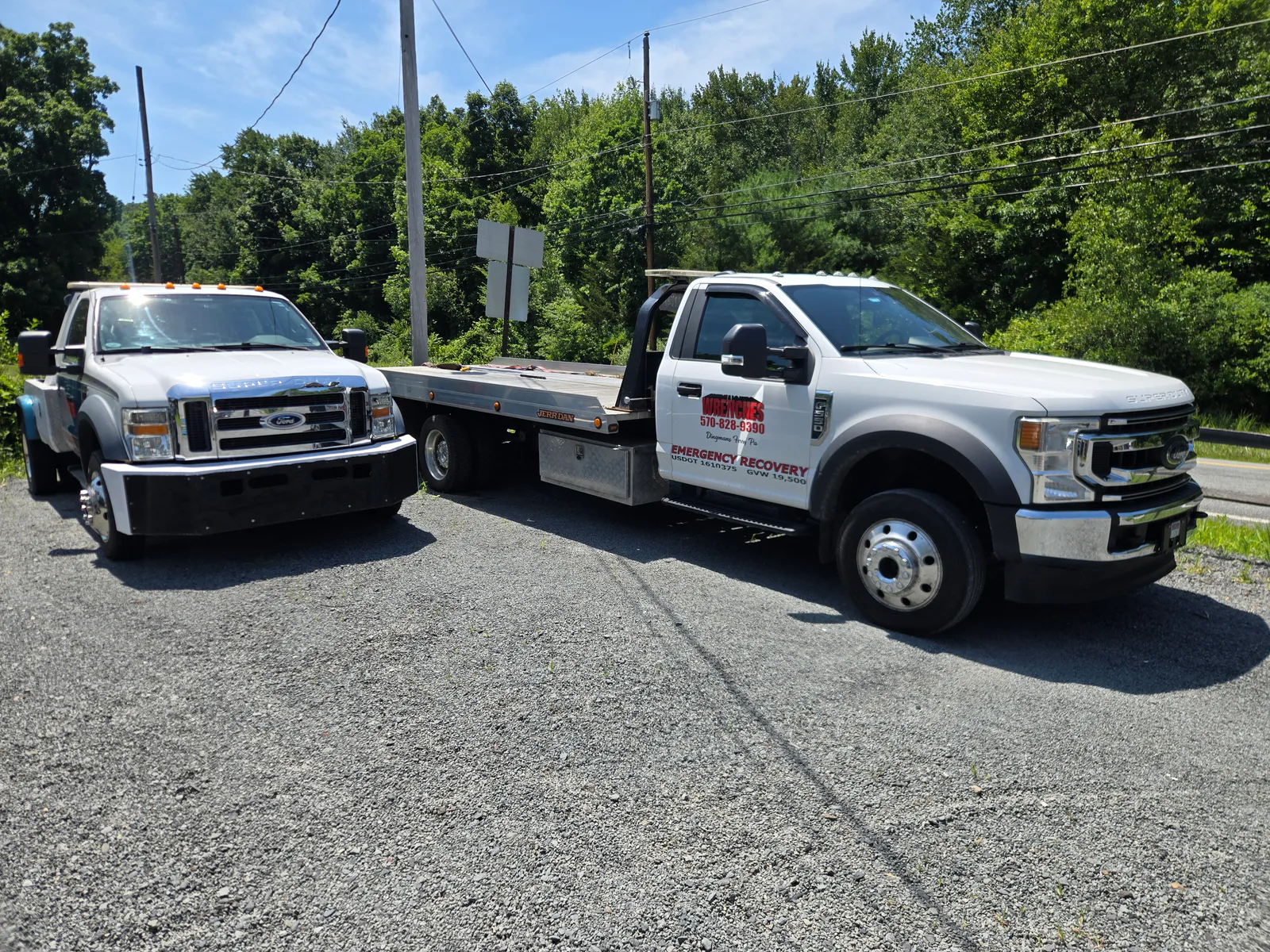 Two Wrenches tow trucks parked together in Dingmans Ferry